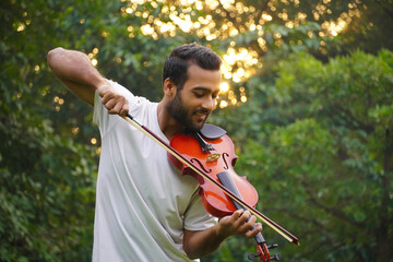 violin player image , musician playing violin. at morning Music and musical tone concept.