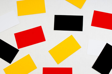 Heap of colorful credit cards at white textured paper background.. Top view.