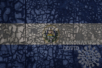 flag of el salvador on a old metal rusty cracked wall with text coronavirus, covid, and virus picture.