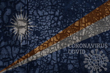 flag of Marshall Islands on a old metal rusty cracked wall with text coronavirus, covid, and virus picture.