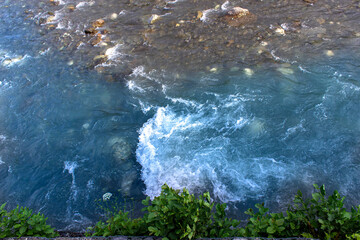 Waves on the mountain river. Top view.