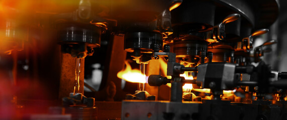Fototapeta na wymiar Firing of glass ampoules at the factory
