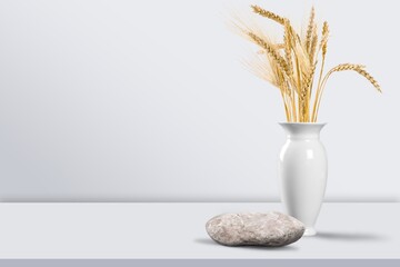 Grey natural stones podium on background, platform for product display and dry branches