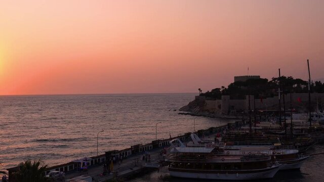 Kusadasi, Turkey - August 23, 2021: Pigeon Island Castle, (Guvercinada kalesi in Turkish) is a tourist attraction.
