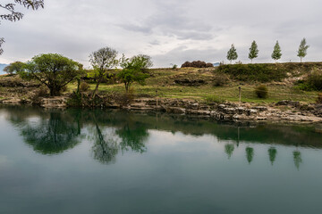 The Podgorica river at the Niagara waterfall with reflectingtrees

