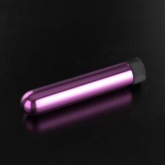 Pink vibrator on dark background. Sex toy