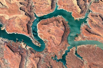 Abwaschbare Fototapete Lachsfarbe Colorado River, Lake Powell and Trachyte Canyon looking down aerial view from above – Bird’s eye view Colorado River, Utah, USA