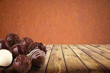 Sweet tasty chocolate candy on the desk