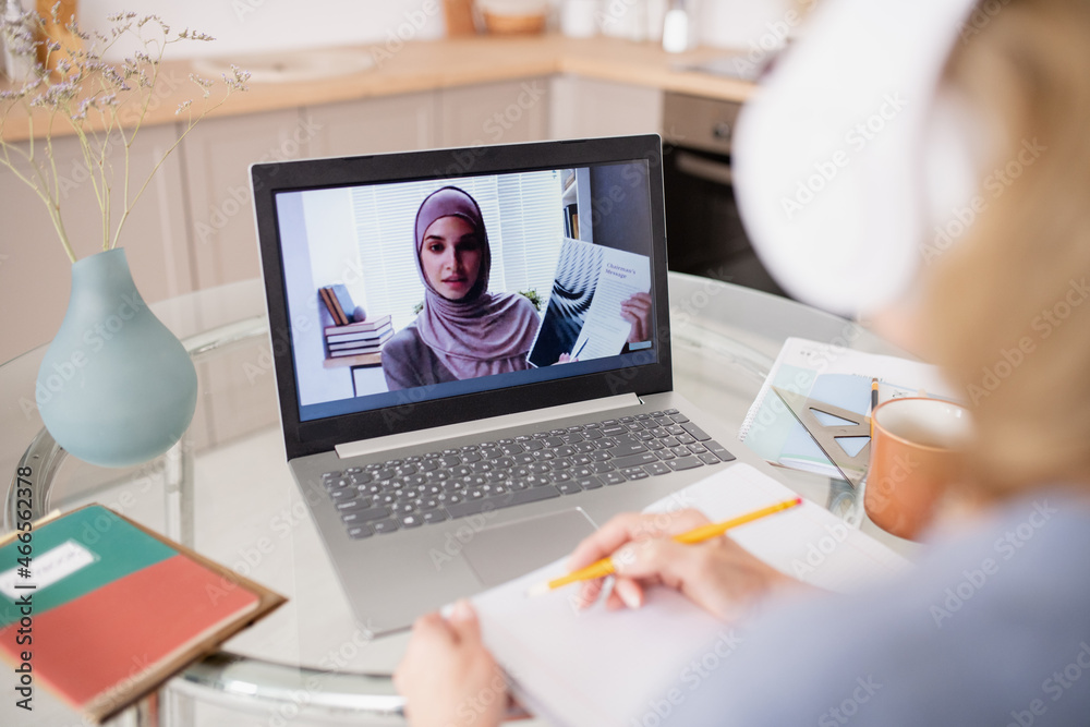 Poster young teacher on laptop screen showing document to online student while presenting and explaining in