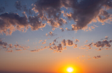 Sunset against the backdrop of dramatic clouds.