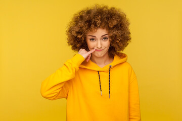 Funny cunning woman with Afro hairstyle suspicion something, fantasizing, thinking over plan,...