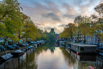 Fototapeta na wymiar Amsterdam sunset city skyline at canal waterfront.