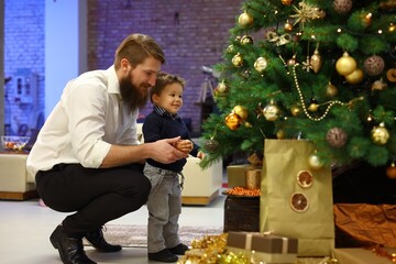 Father and little son celebrating christmas togethre.