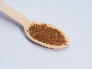 mustard knob on a wooden spoon spice used in the kitchen, macro photo lots of details, white background, eco concept