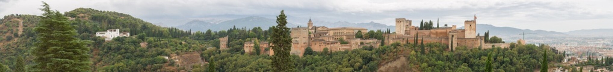 Fototapeta na wymiar Full panoramic exterior at the Alhambra citadel, view Viewpoint San Nicolás, a palace and fortress complex located in Granada, Andalusia, Spain
