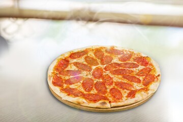Tasty fresh Pizza with vegetables on the desk