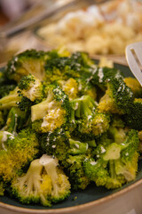 steamed green broccoli close-up on the table