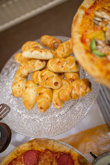 top view of sausages in dough on the buffet table