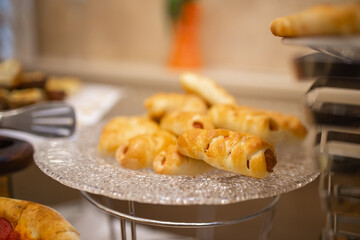 sausages in dough on the buffet table