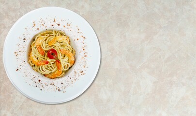 Mixed tasty seafood in plate on a gray stone background. Raw Shrimp, mussels and scallops