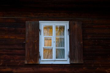 Obraz na płótnie Canvas Window in very old house. Late afternoon light. Autumn.