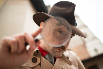 Detective using a magnifying glass