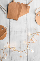 mockup kraft gift boxes with tag on white wooden background