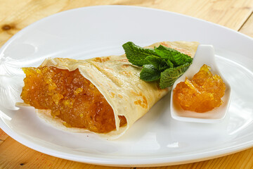 Delicous pancake with fruit jam