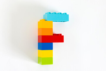 Colorful toy brick letter F