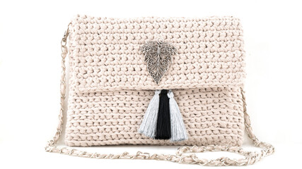handcrafted cream color knit tote bag on a white background