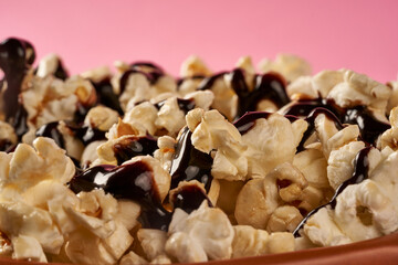 a close up popcorn with chocolate sauce