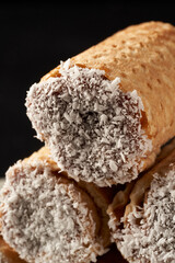 close up ubanitos with dulce de leche and grated coconut. cuchufli.