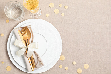 Festive christmas, wedding, birthday table setting with golden cutlery and porcelain plate. Mockup...