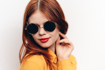 Fototapeta premium glamorous woman in sunglasses red hair close-ups