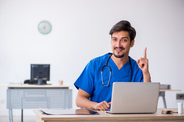 Young male doctor working in the clinic