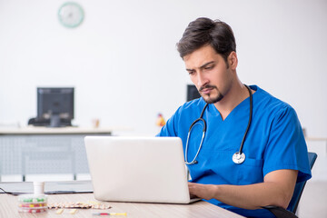 Young male doctor working in the clinic