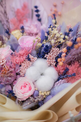 Bouquet dried flower arrangement in pink, yellow and purple. Striking flowers arrangement, comes beautifully wrapped for gift-giving.