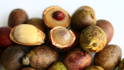 Matoa fruits or Pometia pinnata on white background.