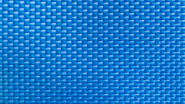 Nylon blue texture. Dark polyester fiber material for sport cloth or abstract weave background. Carbon pattern for wallpaper, graphic design.