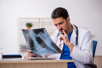 Young male doctor radiologist working in the clinic