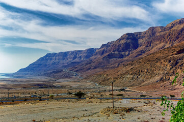 Fototapeta na wymiar Landscape view along Dead Sea coast and Jordanian mountains in the distance, Israel. 