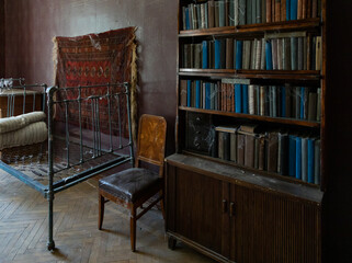 Vintage antique bookcase with books. Selective focus. 