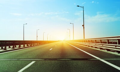 New year 2022 or start straight concept. The road with the sunrise background.