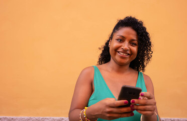 young african american woman with mobile