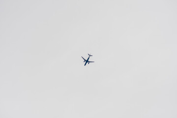 Airplane in Sky on Overcast Day
