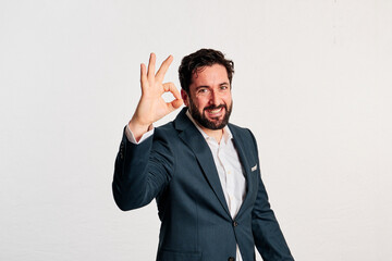 bearded adult male in jacket and shirt with copy space in a studio shot with white background. - 466605170