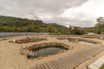 Natural Roman baths outdoors with hot steam and thermal water , Chavasqueira thermal baths, in Ourense, Spain