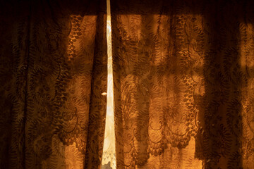 Curtains in the dawn light. Windows in the morning.