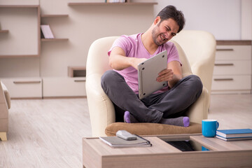 Young man working from home during pandemic