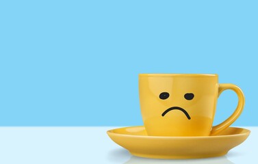 Blue Monday tea with a sad face on the big cup